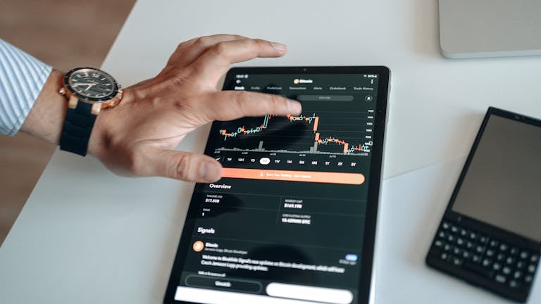 Pxless: A Comprehensive Overview of a Modern Digital PlatformA person analyzing cryptocurrency market trends on a tablet device displaying digital charts.