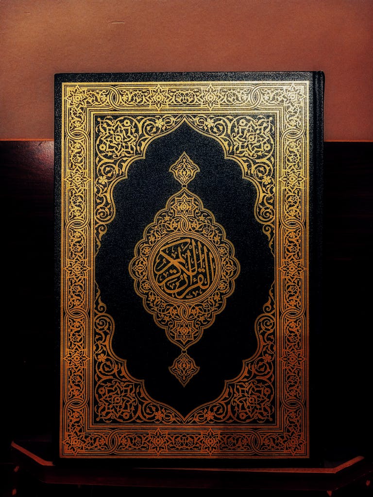 Beautiful Quran with intricate gold patterns on the cover, symbolizing Islamic art and culture.