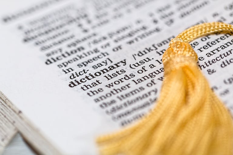 Sterling: Meaning, History, and Its Importance in Modern Life 2026Close-up image of a dictionary page focused on the word 'dictionary' with a yellow tassel.