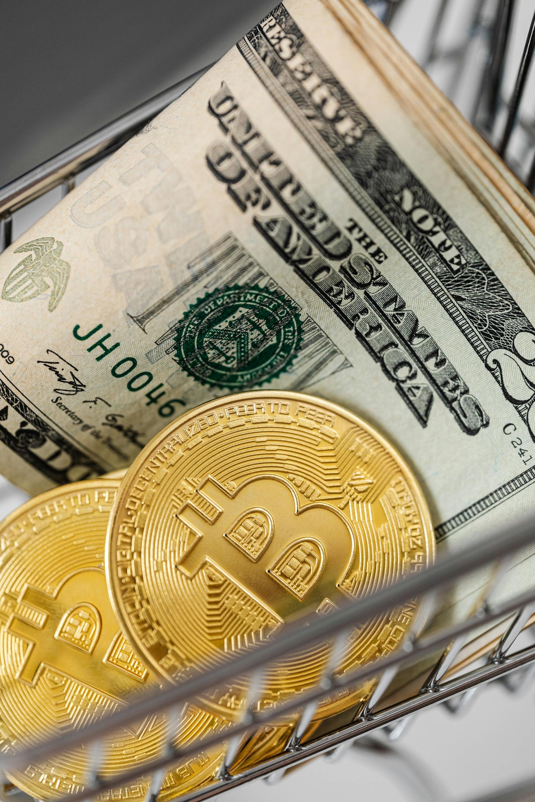 TxMyZone: A Complete Guide to Features, Benefits, Uses, and Future PotentialGold bitcoins and US dollar bills in a small shopping cart representing finance and digital currency.