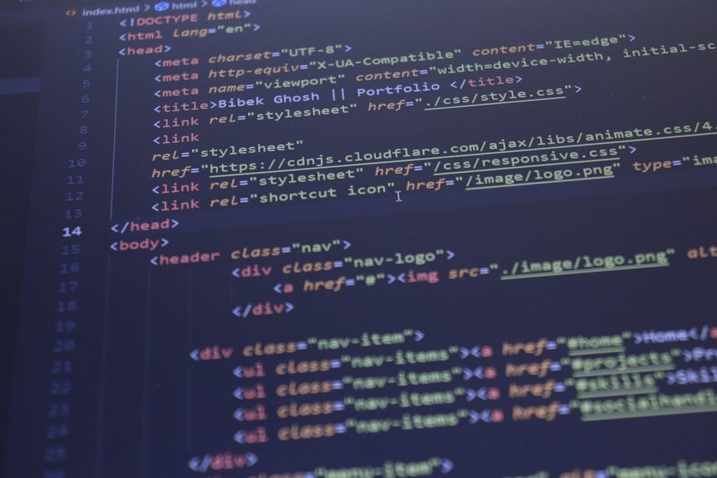 630 Area Code Close-up view of HTML and CSS code displayed on a computer screen, ideal for programming and technology themes.
