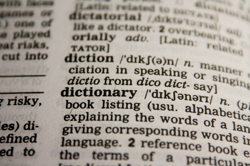 Messagenal Detailed close-up view of a dictionary page highlighting the word 'dictionary' and its definition.