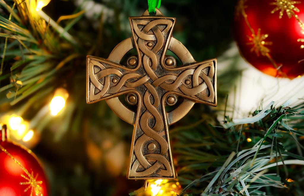 Celtic vs Kairat Prediction: Full Match Preview, Analysis & Betting Insights 2026 Elegant Celtic cross ornament hanging on a Christmas tree with festive decorations.