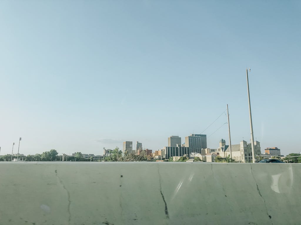 Scenic view of downtown Dayton skyline under a clear blue sky, ideal for urban landscapes.