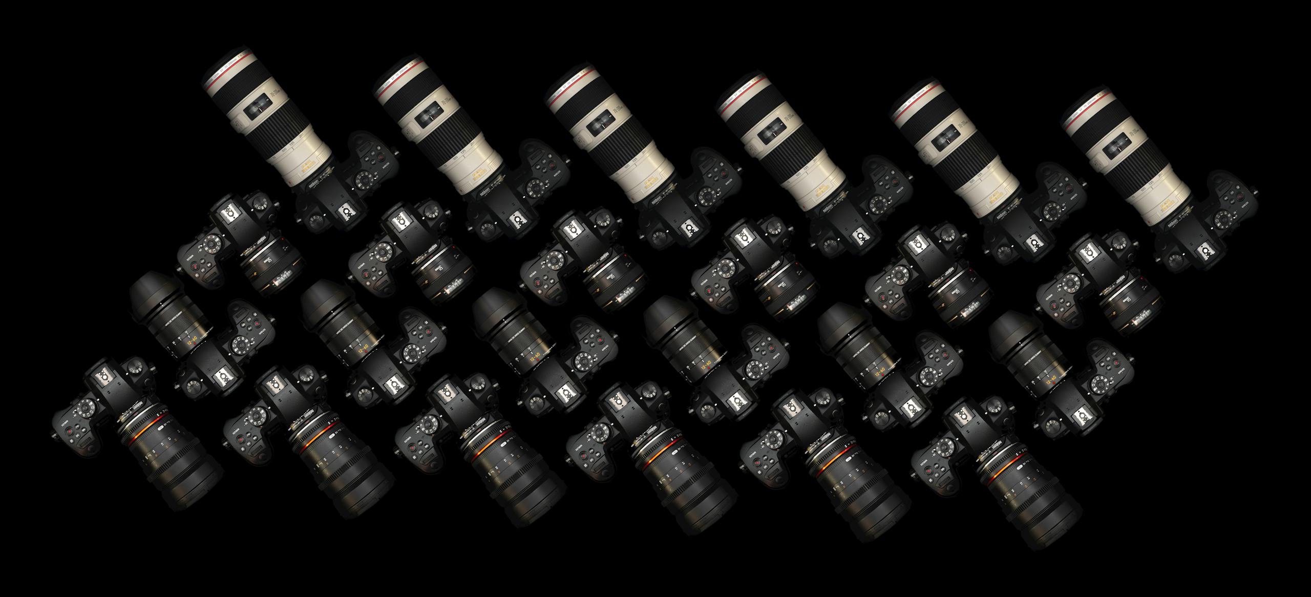 Kongotech Org Top view of multiple DSLR cameras with lenses on a black surface. Perfect for tech and photography themes.