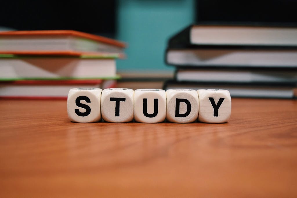 algebra.learning nexus.one of study blocks and stacked books on a wooden desk, symbolizing education and learning.