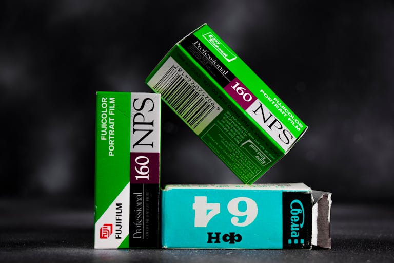 Decreto Supremo 160 Close-up of Fujifilm color portrait film boxes with retro design on a black background. Perfect for photography enthusiasts.