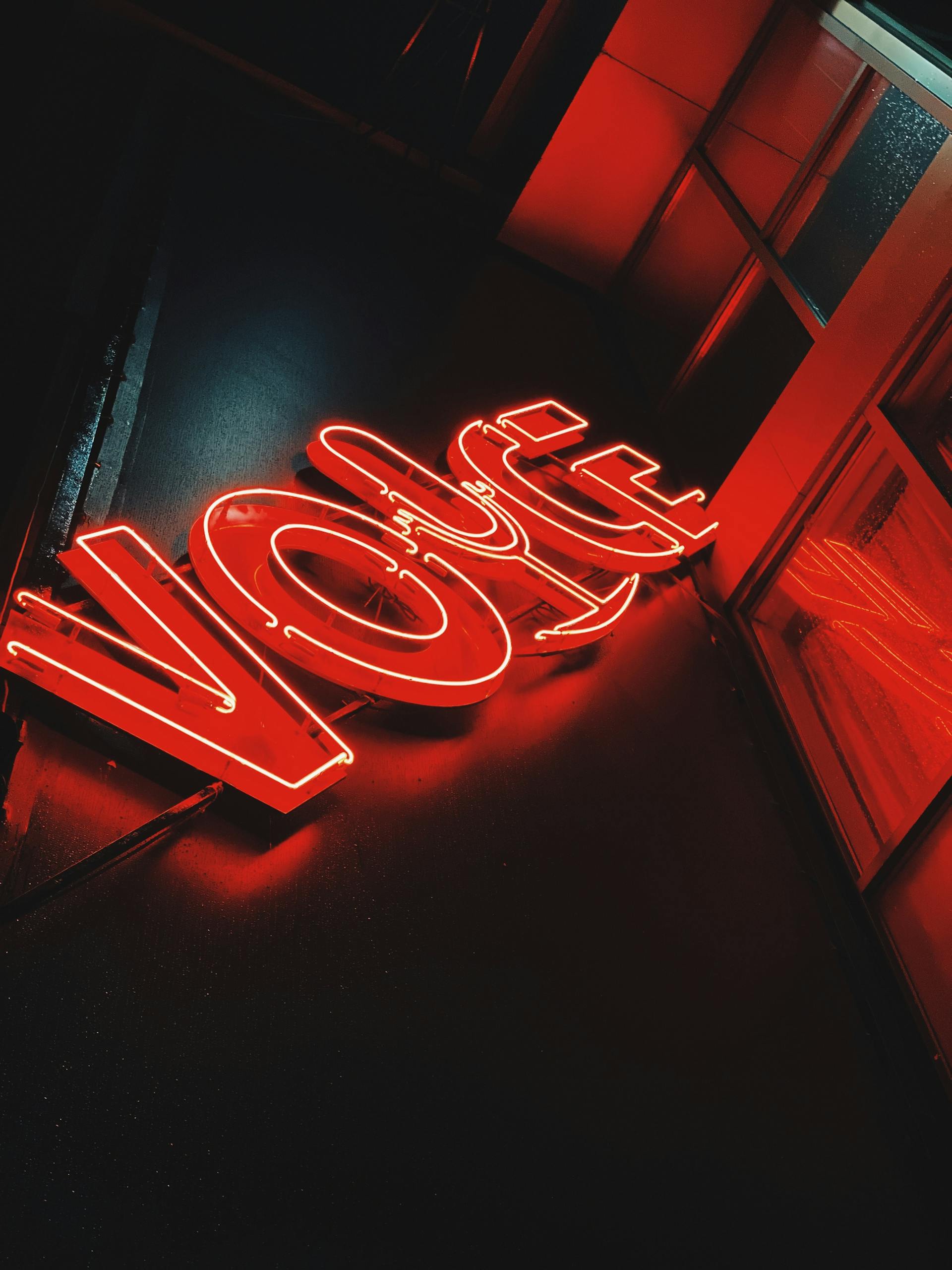 IPLLeague2026 Eye-catching red neon sign displaying the word 'voice' with a dark backdrop.