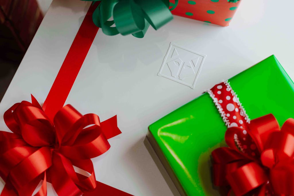 WhatUTalkingBoutWillis Gift Guide Vibrant Christmas presents with red bows perfect for festive celebrations.